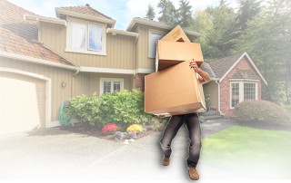 Photo: man carrying moving boxes