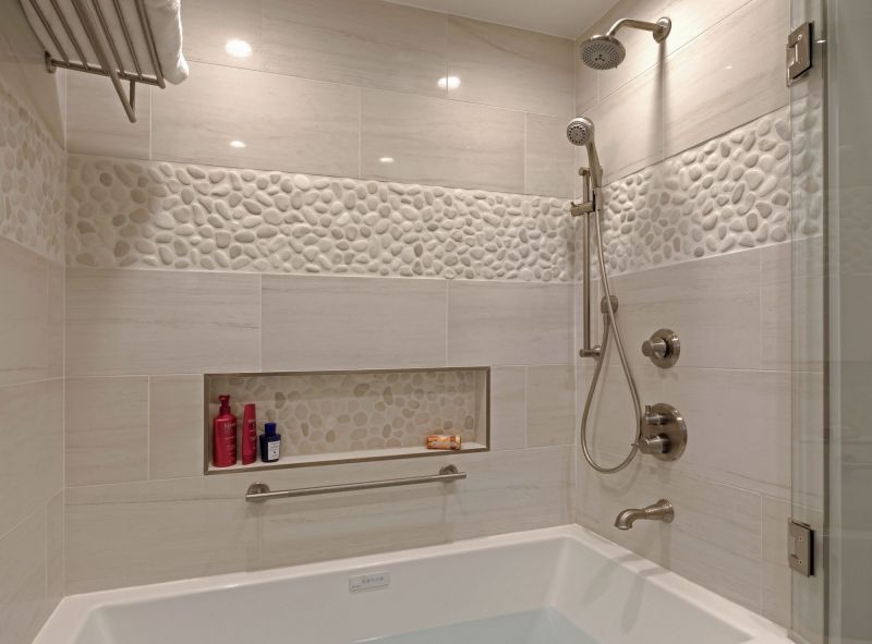 white shower and tub with tile shelf