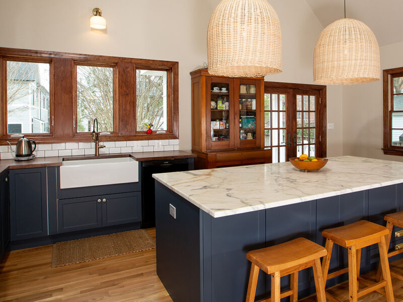 transitional style kitchen with blue cabinets